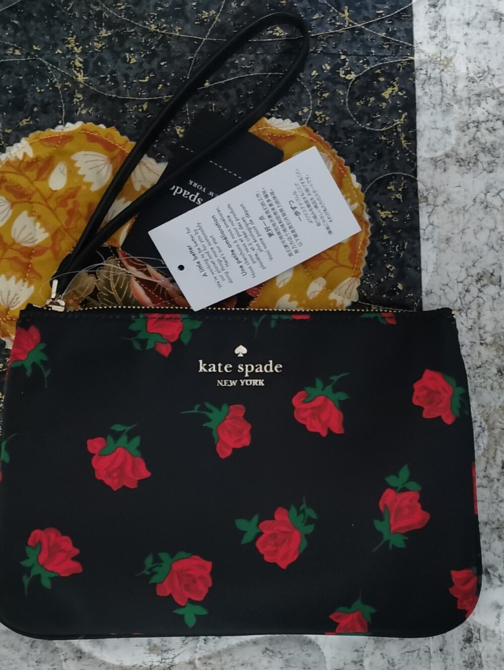kate spade Black Wristlet with Red Rose Print
